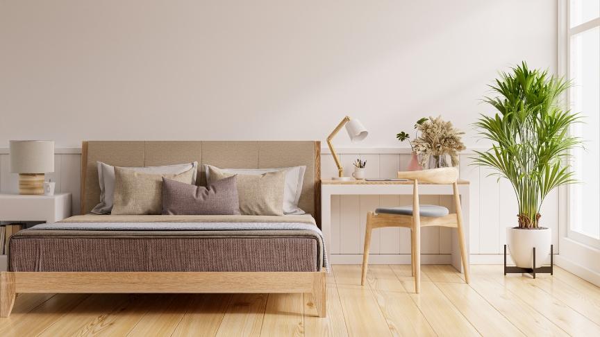 A modern, minimalistic bedroom decorated with beige tones 